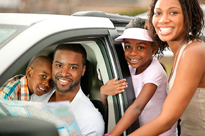 a couple of people that are sitting in a car